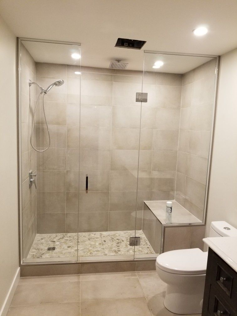 Small bathroom renovation with white vanity and new lighting